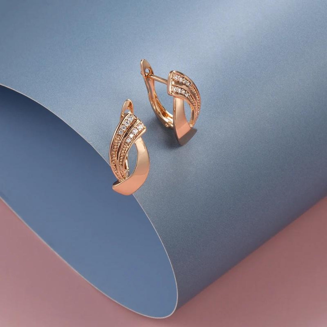 Boucles d'oreilles élégantes avec zirconium en or rose