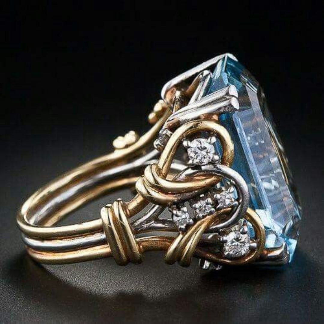 Bague en or striée avec zircon bleu
