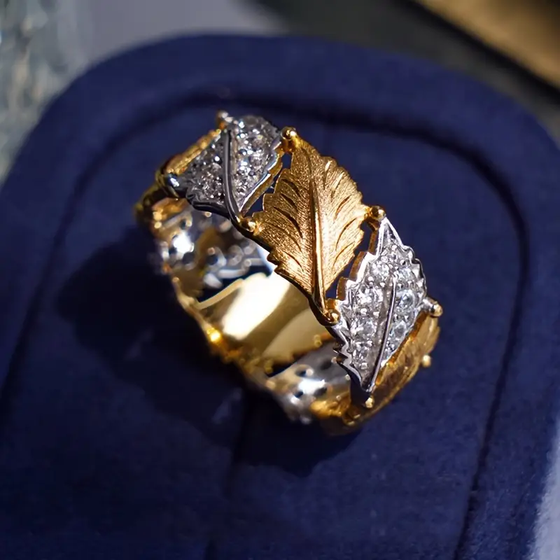 Bague en or avec zirconia et feuilles dorées