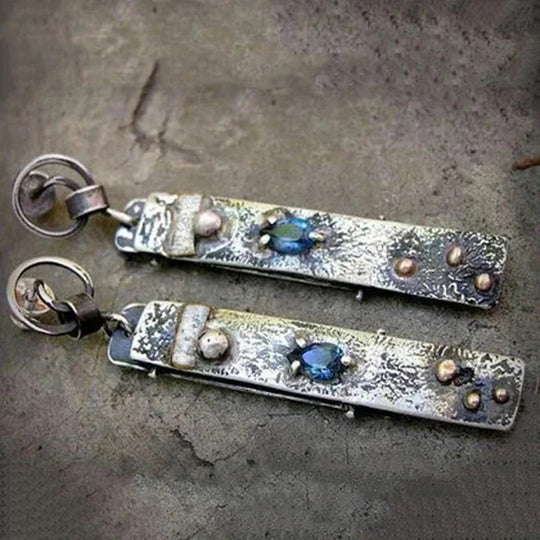 Boucles d'oreilles faites à la main avec des pierres bleues